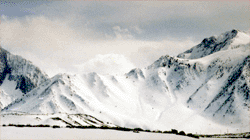 the mountain tops were shrouded in dense white cloud,
